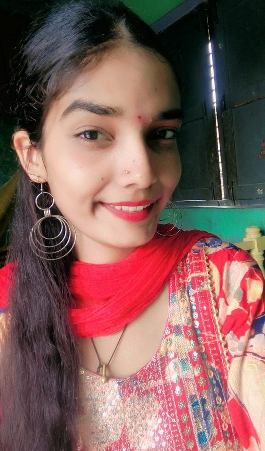 Priyanka smiling in red